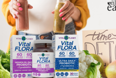 Woman surrounded by fresh whole foods and natural detox ingredients for a spring body cleanse plus more